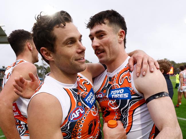 Lachie Ash (right) can sense something special building at the Giants. Picture: Michael Willson/AFL Photos via Getty Images