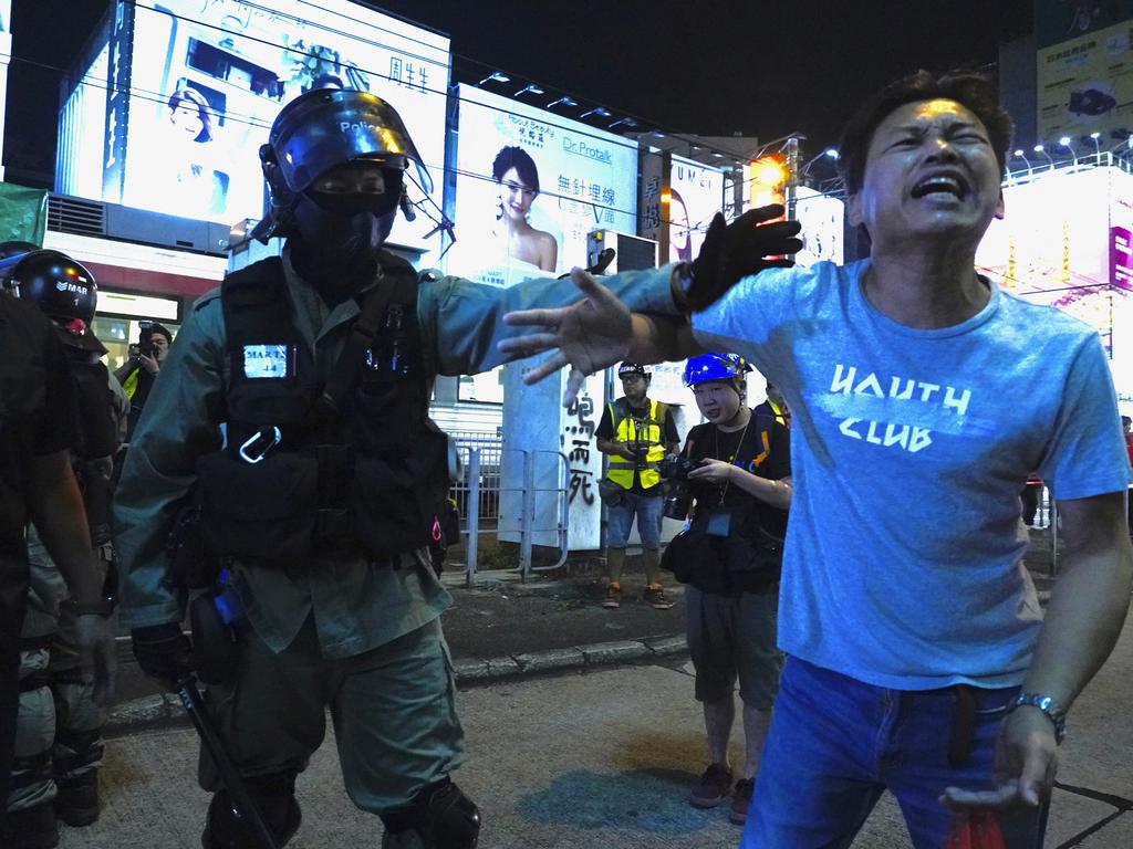 A protester encounters a police officer in Hong Kong over the weekend. Picture: AP