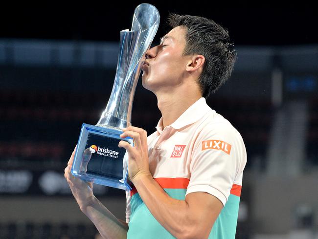 Kei Nishikori celebrates his first crown after nine consecutive losses in ATP finals.