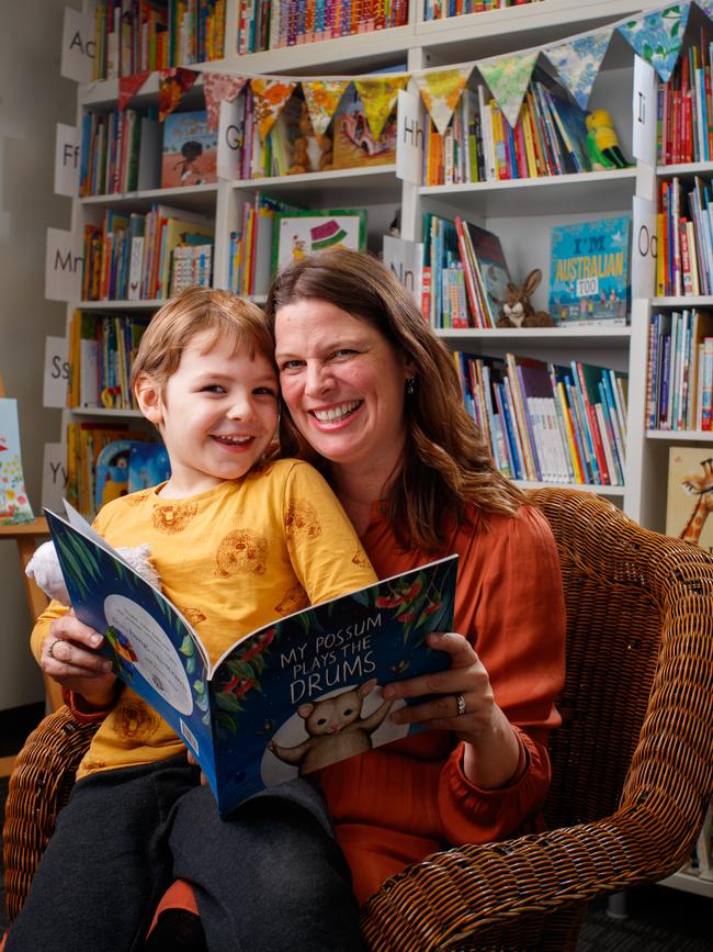 Ellis and son Charlie enjoying a book together at the Raising Literacy Australia office in Norwood. Picture: Matt Turner