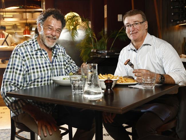 Former Test cricketer and TV personality Mike Whitney and Daily Telegraph journalist Peter Jenkins at Bistro Rex at Potts Point. Picture: Richard Dobson