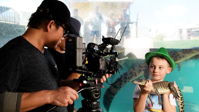 Public Television Service crew members Kuan Yu Chen and Wu Nan Chen are seen filming Darwin local Angus Copeland at Crocasaurus Cove. PICTURE: KERI MEGELUS