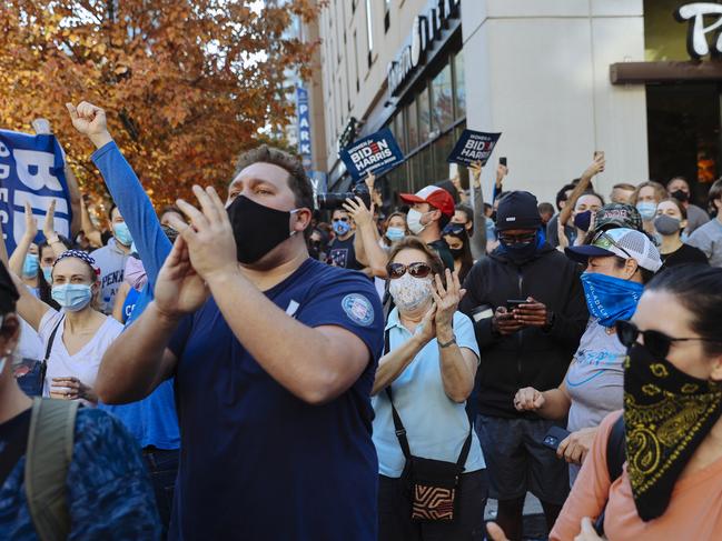 People celebrate outside the Philadelphia Convention Centre after it was announced that Democratic Presidential Candidate, Joe Biden, had won. Picture: Angus Mordant