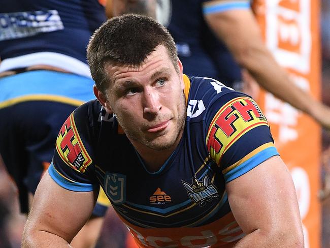 Jai Arrow  of the Titans (centre) is dejected following the Round 9 NRL match between the Gold Coast Titans and the Cronulla Sharks at Suncorp Stadium in Brisbane, Thursday, May 9, 2019.  (AAP Image/Dave Hunt) NO ARCHIVING, EDITORIAL USE ONLY