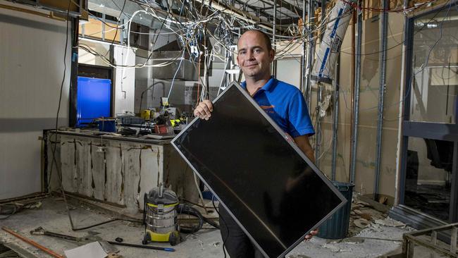 Surfers Paradise RSL club manager Jay Stopford pitches in with the revamp at the club which started this week - but it will continue trading throughout. Picture: Jerad Williams