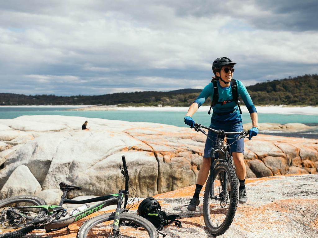 Experiences like the Bay of Fires by bike attract people to Tasmania's East Coast. Picture: Blue Derby Pods Ride