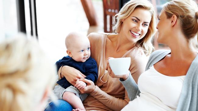 Happy pregnant woman with her friends relaxing at home – with no men in sight. Image: iStock