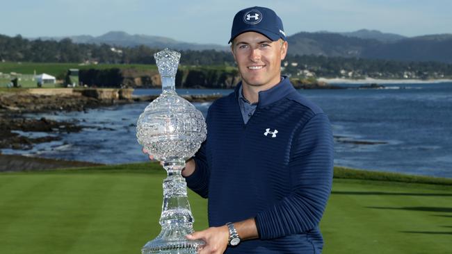 Jordan Spieth poses with the trophy after winning the AT&amp;T Pebble Beach Pro-Am.