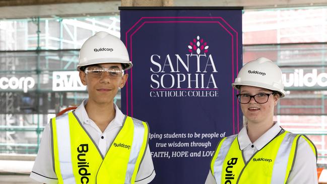 Students Jessica Boland and Vito Galati together with Santa Sophia Catholic College Principal Mark De Vries onsite