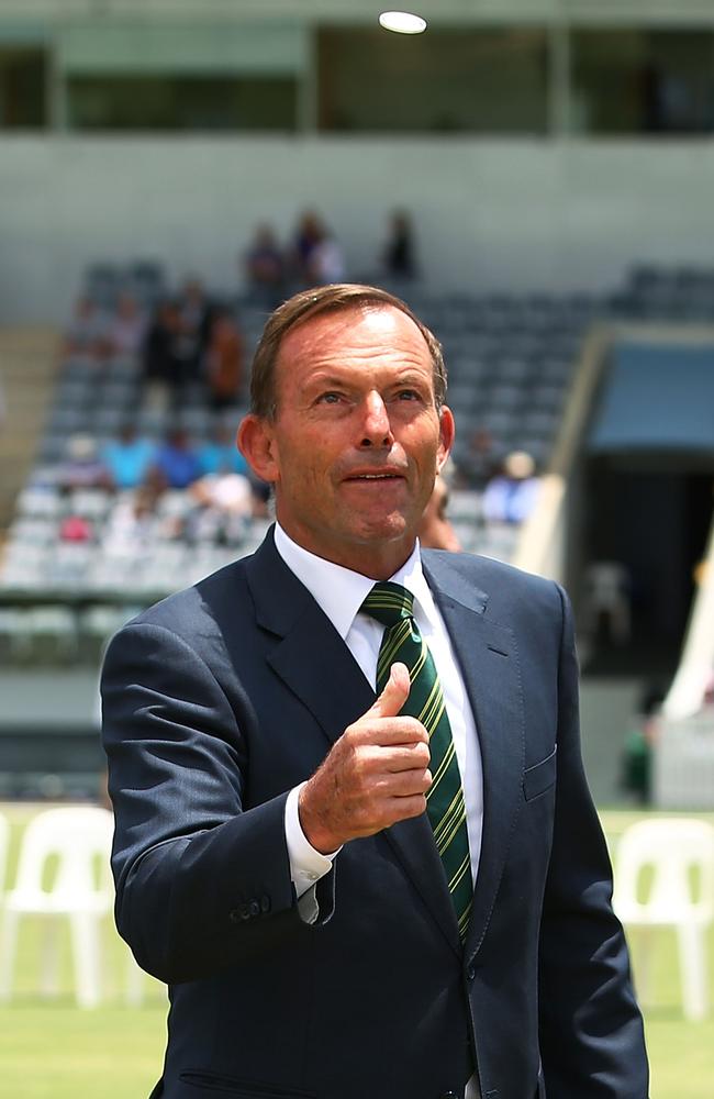 Prime Minister Tony Abbott performs the coin toss before the tour match between the Prime Ministers XI and England at Manuka Oval on January 14. Picture: Mark Nolan/Getty Images