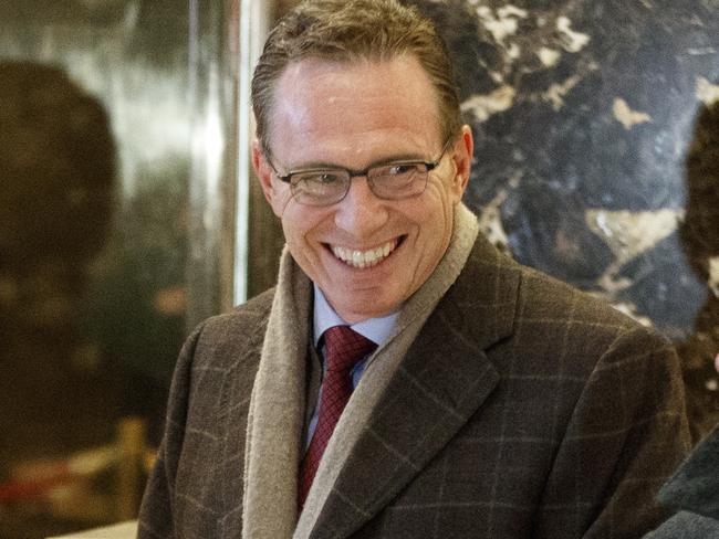 Executives from BHP Billiton Geoff Healy, from left, Andrew Mackenzie, and Jack Nasser stand in the lobby of Trump Tower in New York, Tuesday, Jan. 10, 2017, before meeting with President-elect Donald Trump. (AP Photo/Evan Vucci)