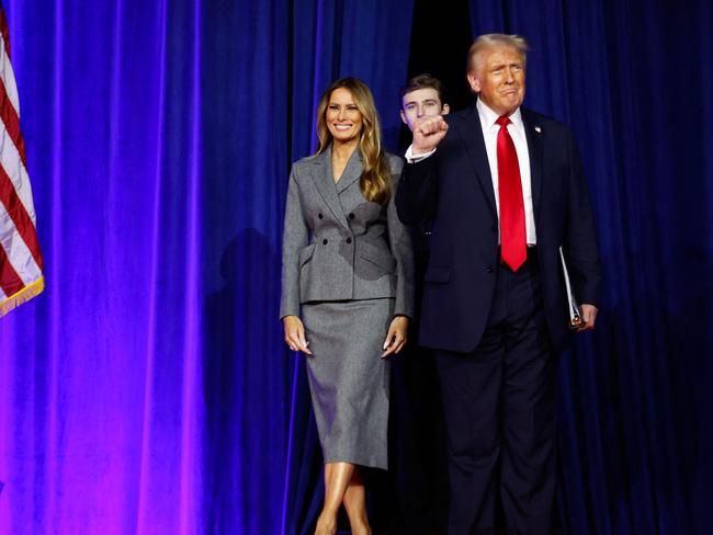 Donald Trump arrives to speak with Melania Trump and Barron Trump during an election night event at the Palm Beach Convention Center. Picture: AFP