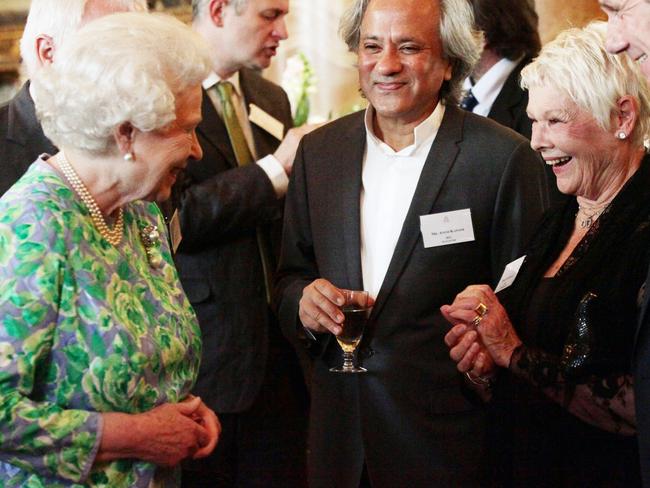 Dench sharing a laugh with our current monarch, Queen Elizabeth, at Buckingham Palace in 2011. Picture: Yui Mok/Getty Images