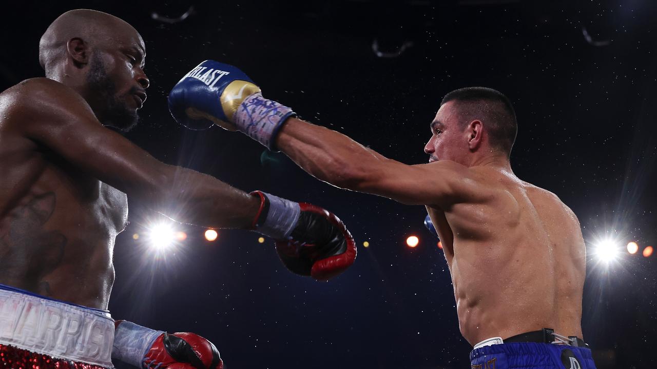 Tim Tszyu punches Tony Harrison during the WBO super-welterweight world title fight. Picture: Mark Kolbe