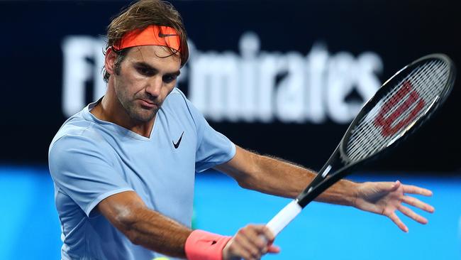 Roger Federer plays a backhand to Geman Alexander Zverev at the Hopman Cup in Perth. Picture: Getty Images