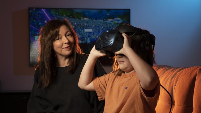 Jessica Ducrou, co-founder of Splendour in the Grass music festival, with her son Miller wearing a VR headset. Picture: Chris Pavlich