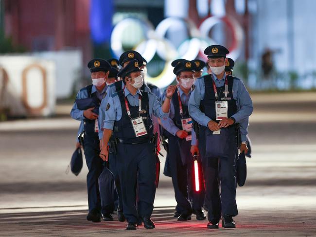 Police Officers stand guard outside the stadium during the Opening Ceremony.