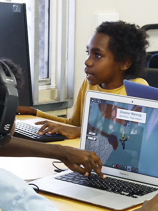 Lamai Woolla, 10, plays computer games in the Aurukun Shire Council's Knowledge Centre for children in Aurukun. Picture: Brendan Radke