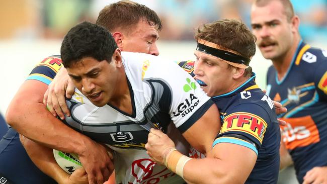 Jarrod Wallace (right) helps to bring Jason Taumalolo to a halt. Picture: Getty Images