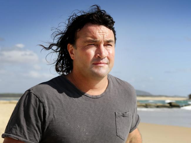 BSM 16.1.13 Stand up paddle boarder Jason Diprose is against shark culling dispite a recent close encounter with a large tiger shark. Pictured at Maroochy river mouth where the encounter happened. Pic Megan Slade. Story Peter Hall.