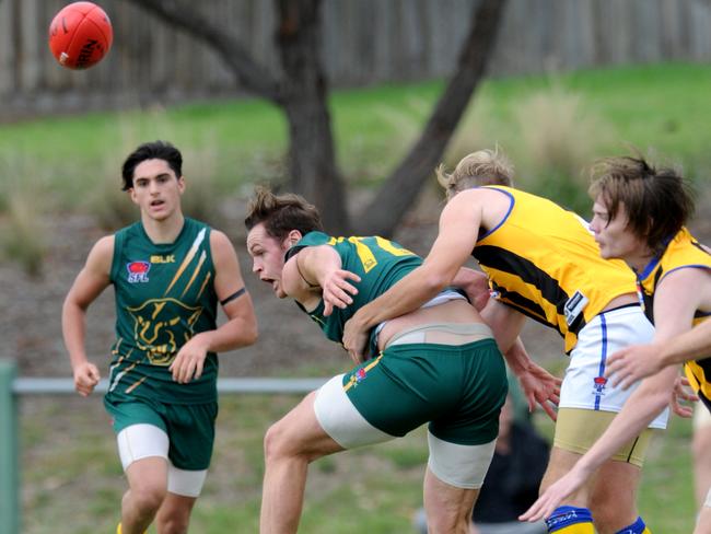 Mt Waverley and Hampton players contest the ball in a 2017 match.