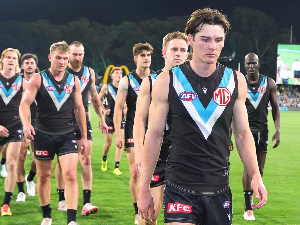 Connor Rozee leads his dejected troops from the ground. Picture: Getty Images