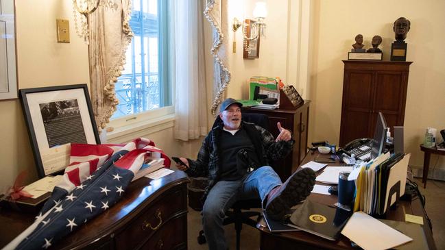 One of Joseph’s McBride’s clients is Richard Barnett, pictured in Nancy Pelosi’s office on the day of the riot. Picture: AFP