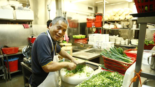 Preparing food in the kitchen of Golden Century. Picture: Bradley Hunter