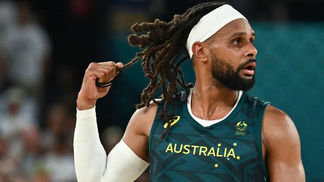 Australia's #05 Patty Mills reacts after in the men's quarterfinal basketball match between Serbia and Australia during the Paris 2024 Olympic Games at the Bercy  Arena in Paris on August 6, 2024. (Photo by Aris MESSINIS / AFP)