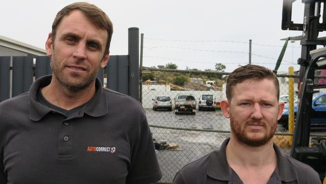 Mark Hangan and Dominic Randall in front of the fence that was damaged in the ram-raid.