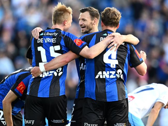 AUCKLAND, NEW ZEALAND - OCTOBER 27: Francis De Vries of Auckland FC, Tommy Smith of Auckland FC and Nando Pijnaker of Auckland FC celebrate after winning the round two A-League Men match between Aukland FC and Sydney FC at Go Media Stadium, on October 27, 2024, in Auckland, New Zealand. (Photo by Hannah Peters/Getty Images)