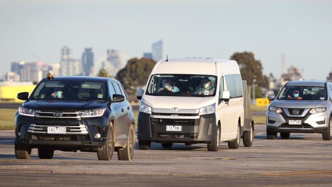 A convoy takes Ms Coffey from the airport to her quarantine hotel. Picture: David Caird