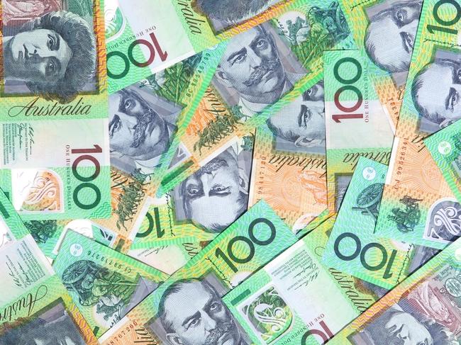 Australian one hundred dollar notes make a full-frame background.