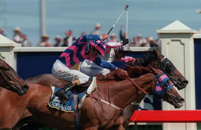 Cassidy rides Might and Power Jim Cassidy (back) in the 1997 Melbourne Cup race.