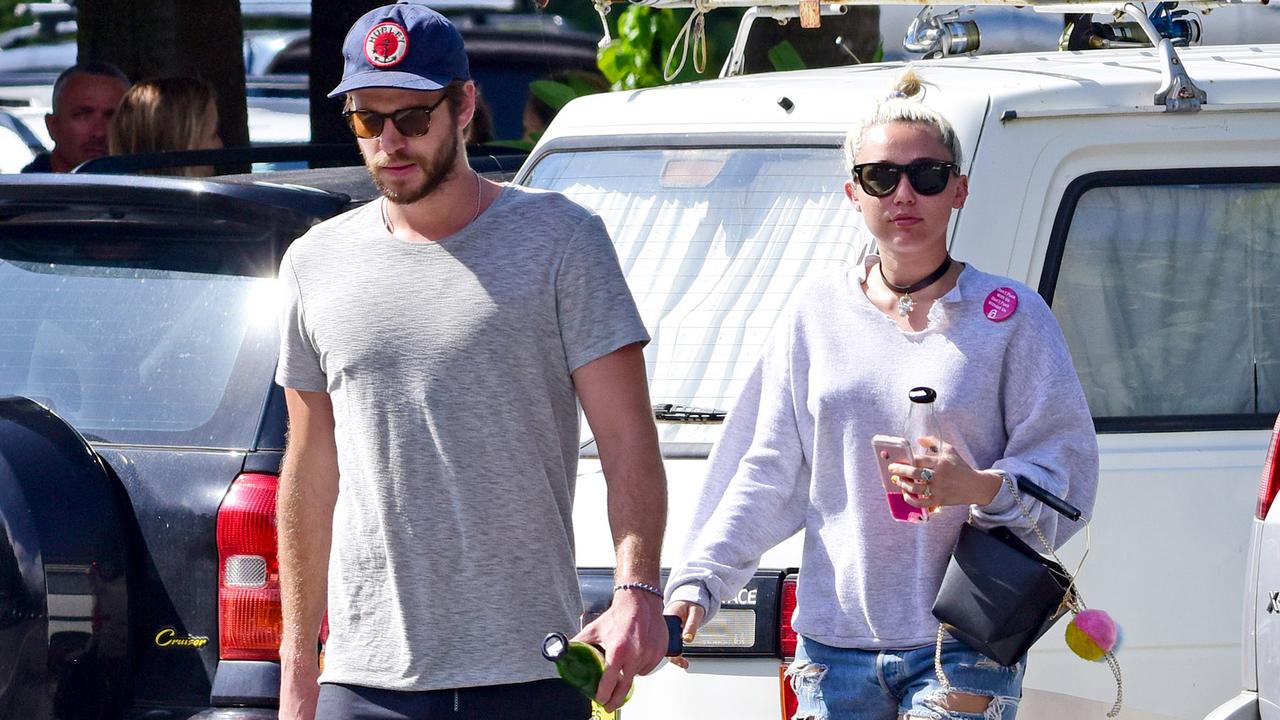 Hemsworth and Cyrus during happier times in Byron Bay. Picture: Matrix/GC Images