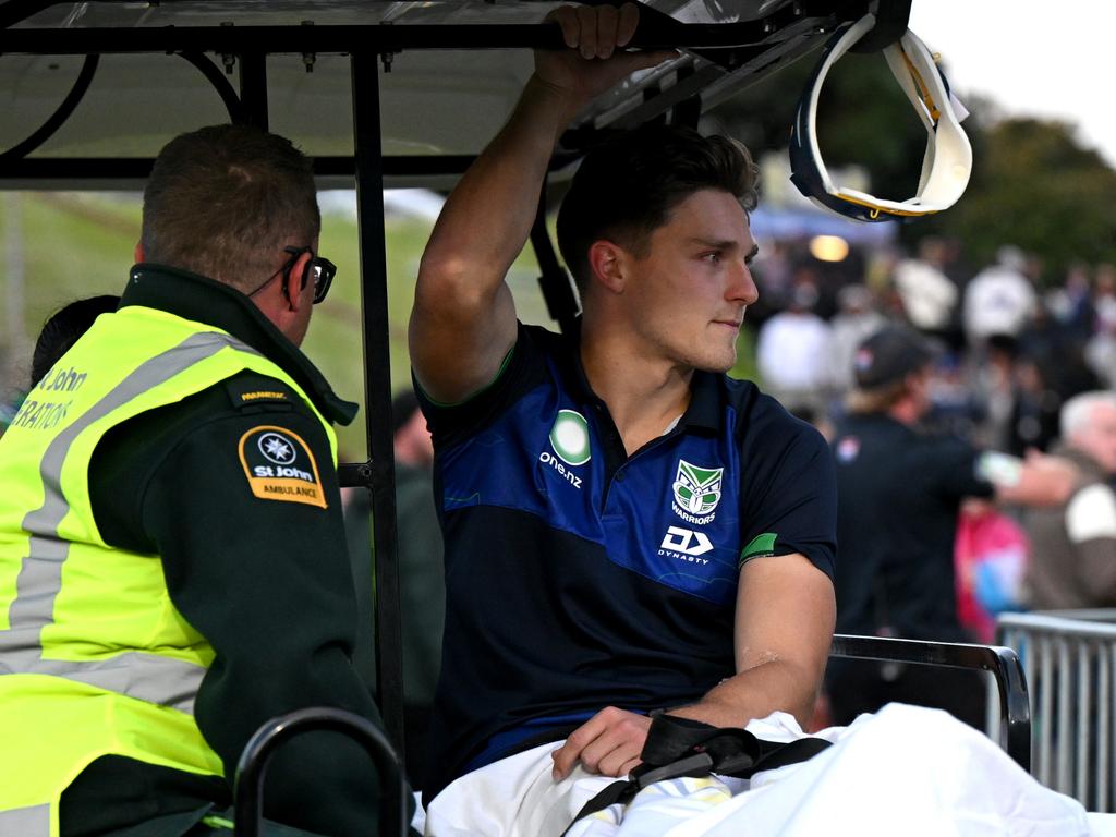 Luke Metcalf of the Warriors is taken off injured. Picture: Hannah Peters/Getty Images