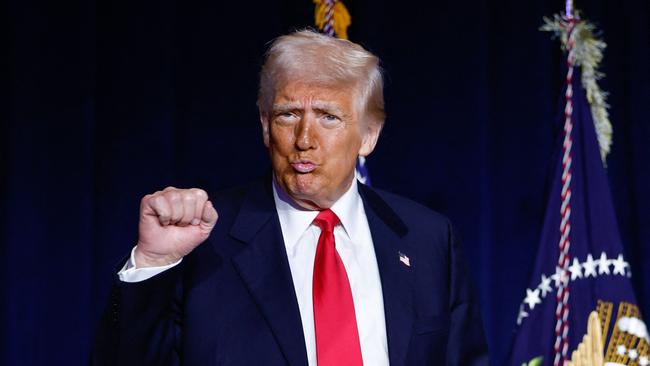 TOPSHOT - US President Donald Trump gestures as he arrives to speak during the National Prayer Breakfast at the Washington Hilton in Washington, DC, on February 6, 2025. (Photo by Ting Shen / AFP)