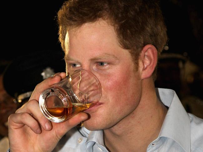 BELIZE CITY, BELIZE - MARCH 02:  Prince Harry enjoys a drink as he attends a Jubilee Block Party on March 2, 2012 in Belmopan, Belize. The Prince is visiting Belize as part of a Diamond Jubilee tour where he will be visiting Belize, the Bahamas, Jamaica and Brazil as a representative of Queen Elizabeth II. Belize is a Commonwealth realm with a population of around 350,000. With the second longest barrier reef in the world and with much of the country covered in tropical jungle with a diversity of wildlife Belize relies heavily on tourism.  (Photo by Chris Jackson-Pool/Getty Images)