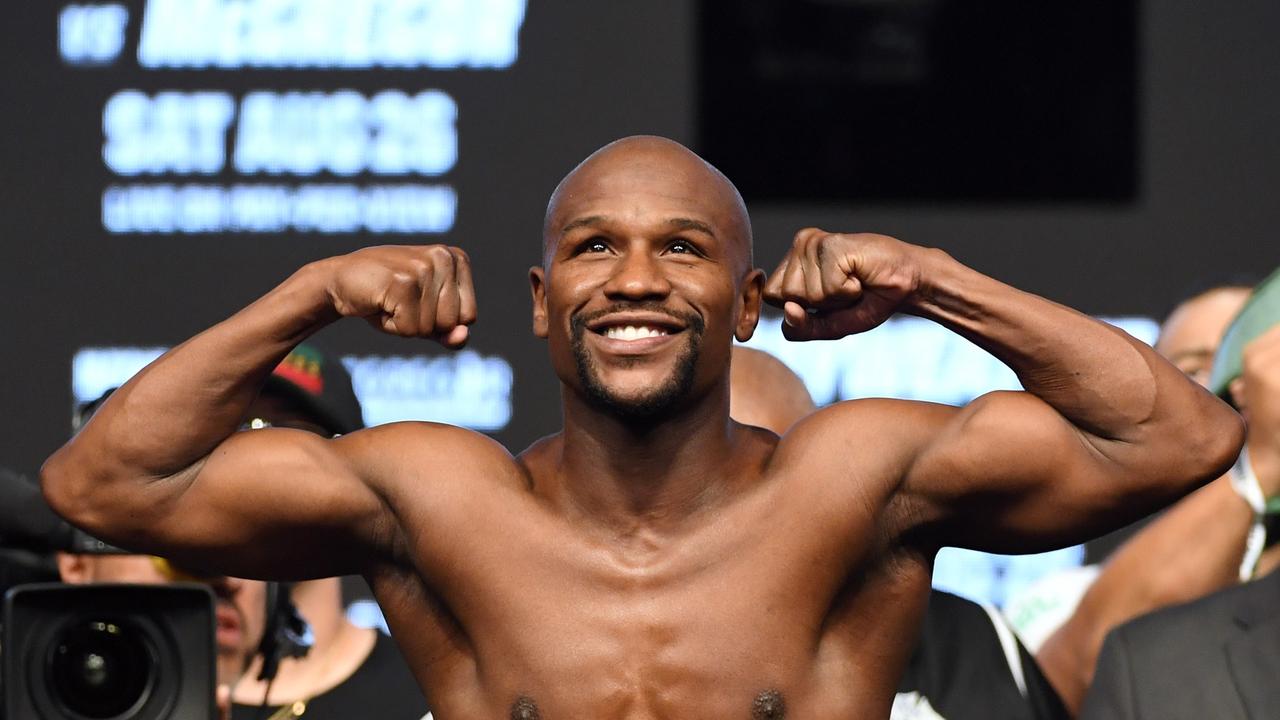 LAS VEGAS, NV - AUGUST 25: Boxer Floyd Mayweather Jr. poses on the scale during his official weigh-in at T-Mobile Arena on August 25, 2017 in Las Vegas, Nevada. Mayweather will meet UFC lightweight champion Conor McGregor in a super welterweight boxing match at T-Mobile Arena on August 26. Ethan Miller/Getty Images/AFP == FOR NEWSPAPERS, INTERNET, TELCOS &amp; TELEVISION USE ONLY ==