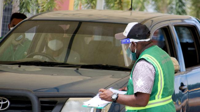 A person arrives at a Covid-19 makeshift clinic in a sports stadium in Port Moresby.