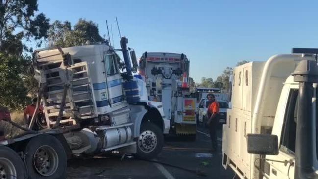 Logging truck rolls down embankment