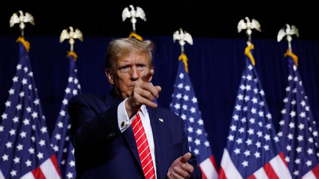 Republican presidential candidate and former US President Donald Trump leaves the stage at the conclusion of a campaign rally at the Forum River Centre.