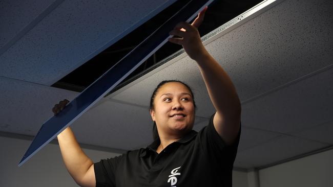 Apprentice electrician Barbara Fetolofai at work. Picture: David Swift