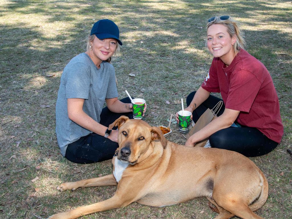 Meg Fearby (left) and Mel Eglington with Winston the ridgeback at the Murphys Creek Chilli and Craft carnival. Sunday, September 22, 2024. Picture: Nev Madsen