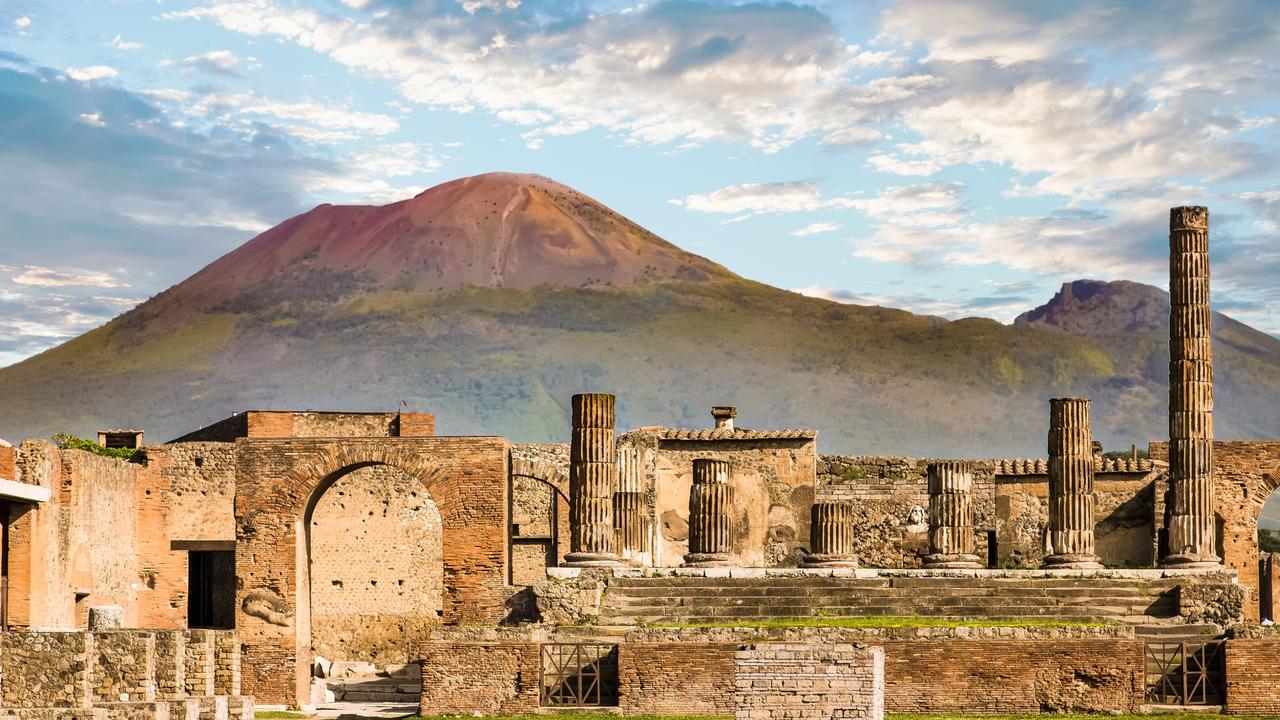 Ancient walls in Pompeii with Vesuvius volcano in the background. Picture: Supplied
