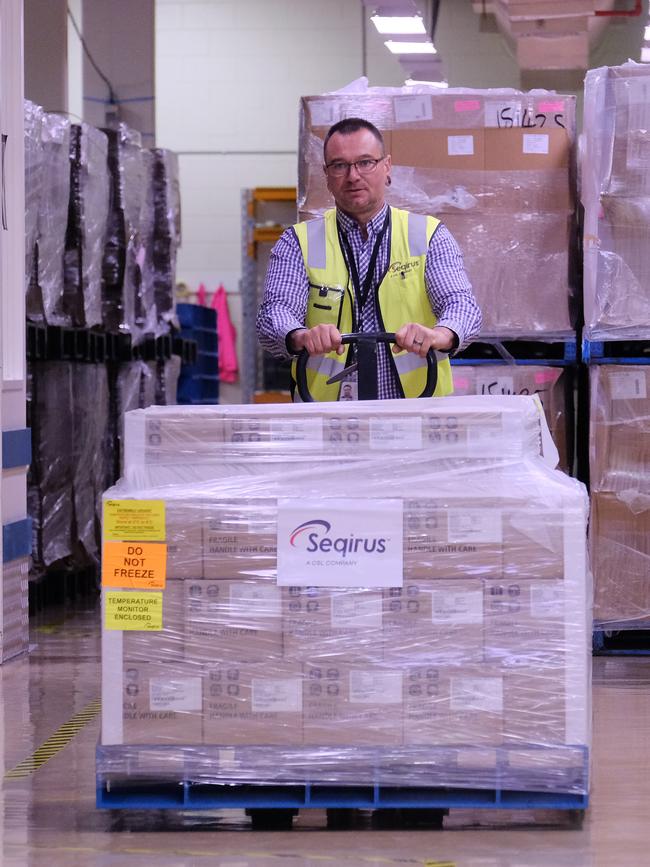 A CSL worker rolls out a batch of the AstraZeneca vaccine. Picture: Getty Images