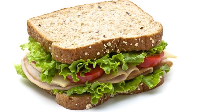 EMBARGO FOR TWAM, 08 FEBRUARY 2025. FEE MAY APPLY. Healthy turkey sandwich with swiss cheese, lettuce and tomato. Isolated with soft shadow.