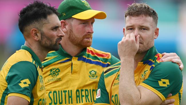 BRIDGETOWN, BARBADOS - JUNE 29: Heinrich Klaasen, Keshav Maharaj and David Miller of South Africa cut dejected figures following the ICC Men's T20 Cricket World Cup West Indies & USA 2024 Final match between South Africa and India at Kensington Oval on June 29, 2024 in Bridgetown, Barbados. (Photo by Gareth Copley/Getty Images)