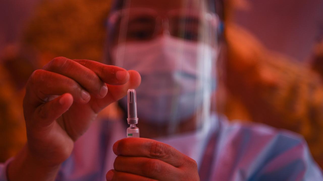 A health worker shows a pre-filled syringe of the Chinese-made Vero Cell Covid-19 vaccine in Kathmandu. Picture: PRAKASH MATHEMA / AFP.