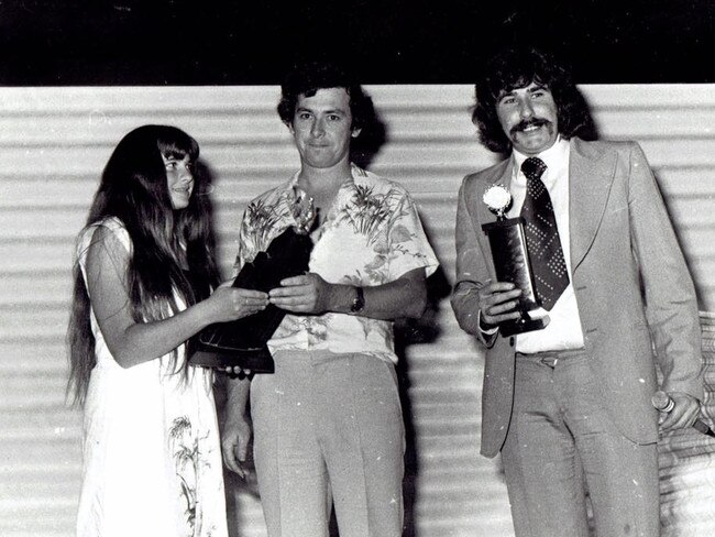 Phil Charlton (centre) receiving Mt Eliza Cricket Club’s “McCue Memorial Trophy”, named in honour of Maurice and Bridget McCue, from “Cuey” and his sister Patsy in 1980-81.